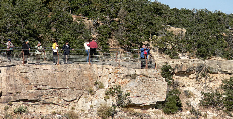 Lots of people standing at the Canyon