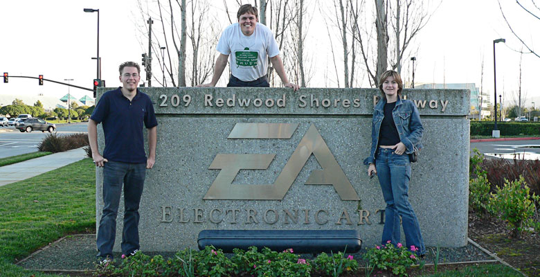 Tim, Daniel and Zhanna in front of the EA sign