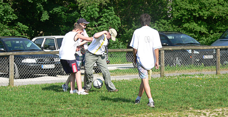 Yvonne is trying to get the soccer ball