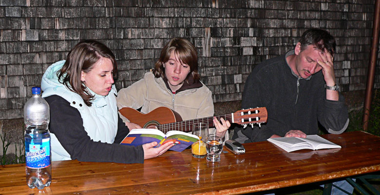 Yvi, Annette and Jochen are singing worship songs.