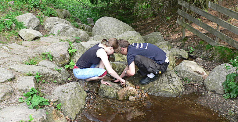 Annette and Alex building a dam.