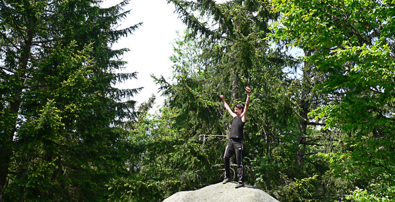 Florian is the first on top of a rock.