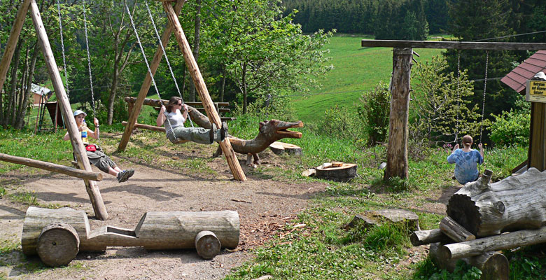 Three girls on swings